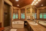 Master bath with spa tub and separate shower